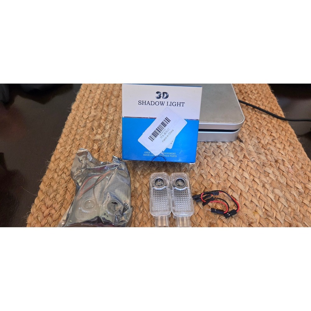 Wireless Car Door Light Projector 4pcs Per Box, Black‎ New LED 3D Shadow Light.